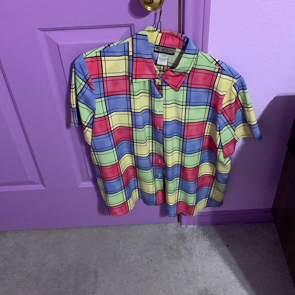 This cute multicolor button-down shirt is in good condition and was rarely worn.